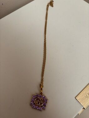 Gucci Gold Necklace with Purple Crystal GG Pendant
